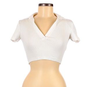 This is a crop, white collar neck from the brand caution with the wind.